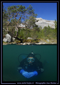 My wife Caroline diving a Lake in the Swiss Alps... Que d... by Michel Lonfat 